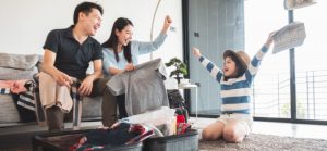 Asian family packing for vacation for Quotacy blog Prepare house for vacation