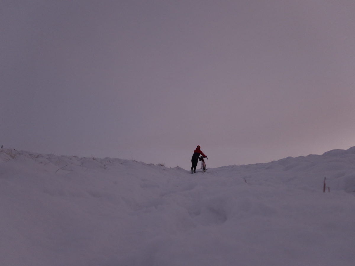 walking in the snow with bike