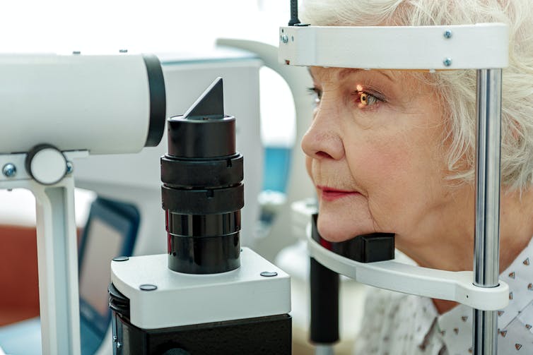 Elderly lady doing an eye test.