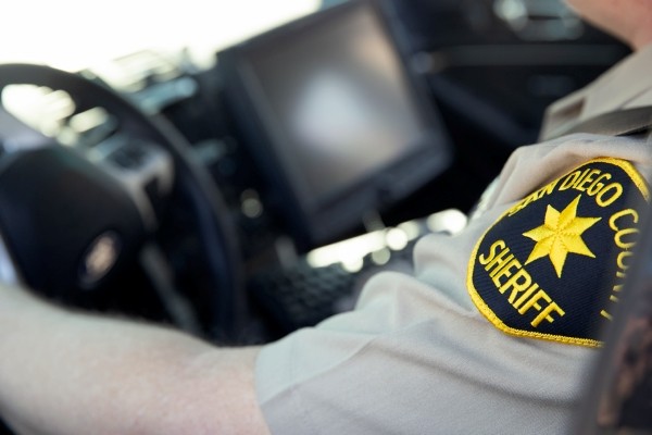 sheriff sitting in a car