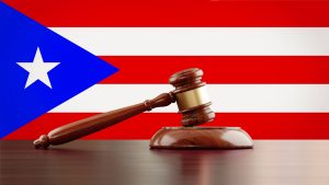 Wooden Gavel In Front Of Puerto Rican Flag