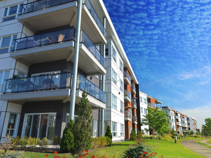 Condo with sunny blue sky background