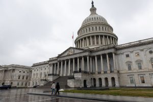 Pedestrians are seen walking in front of the U.S. Capitol in Washington.