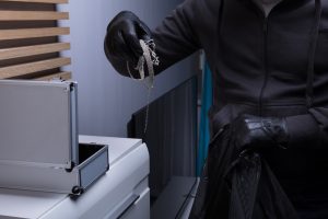 Robber Wearing Gloves Stealing Jewelry