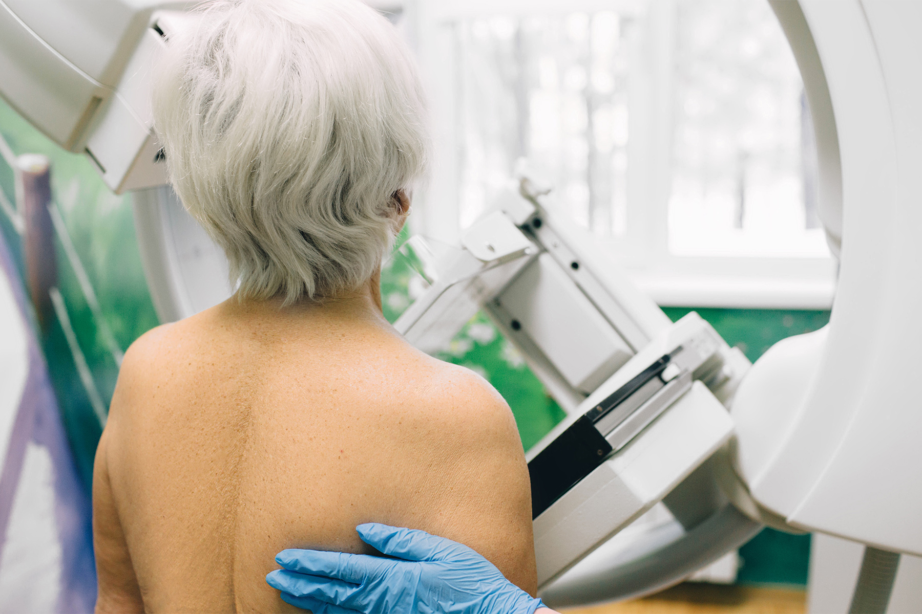 a woman having a mammography scan at hospital