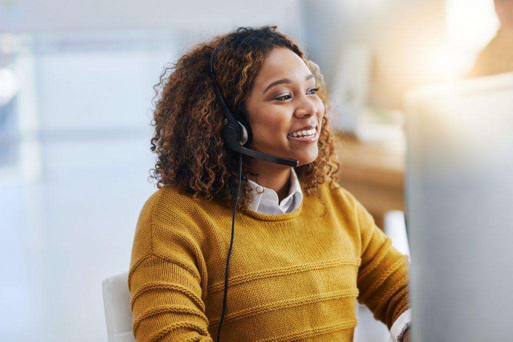 Health Coach taking a call on a phone headset