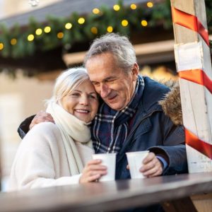 Happy retiree couple outside during the holidays