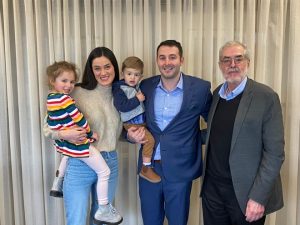 Southcoast Insurance Group Proprietor Nick Daddona and his wife and children pose for a photo with José Cardoso, former owner of the Cardoso Insurance Agency, Inc.