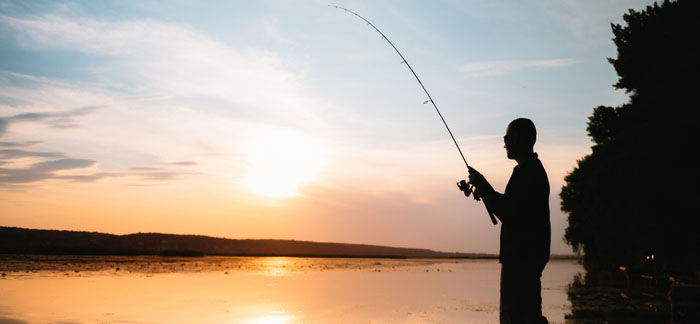 man fishing for Quotacy blog Tips to Help You Achieve Early Retirement