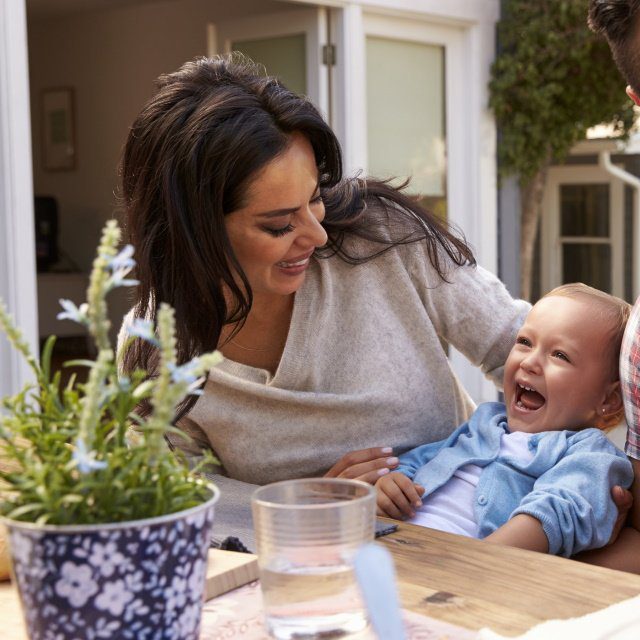 Family At Home Eating Outdoor Meal In Garden Together. Credit:Monkey Business Images/Shutterstock.com