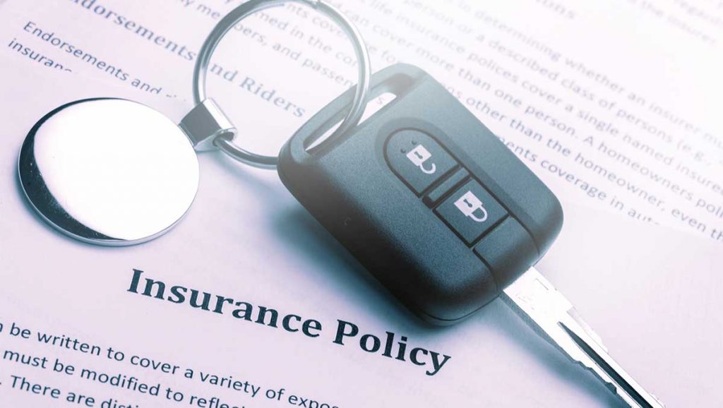 Insurance policy contract and car key - car insurance with a suspended license