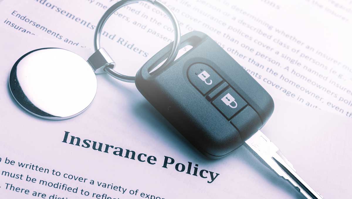 Insurance policy contract and car key - car insurance with a suspended license