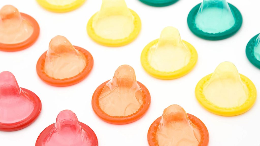 A photo of condoms of various colors.