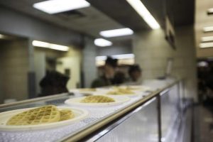 U.S. Marines receive hot chow at Camp Johnson.