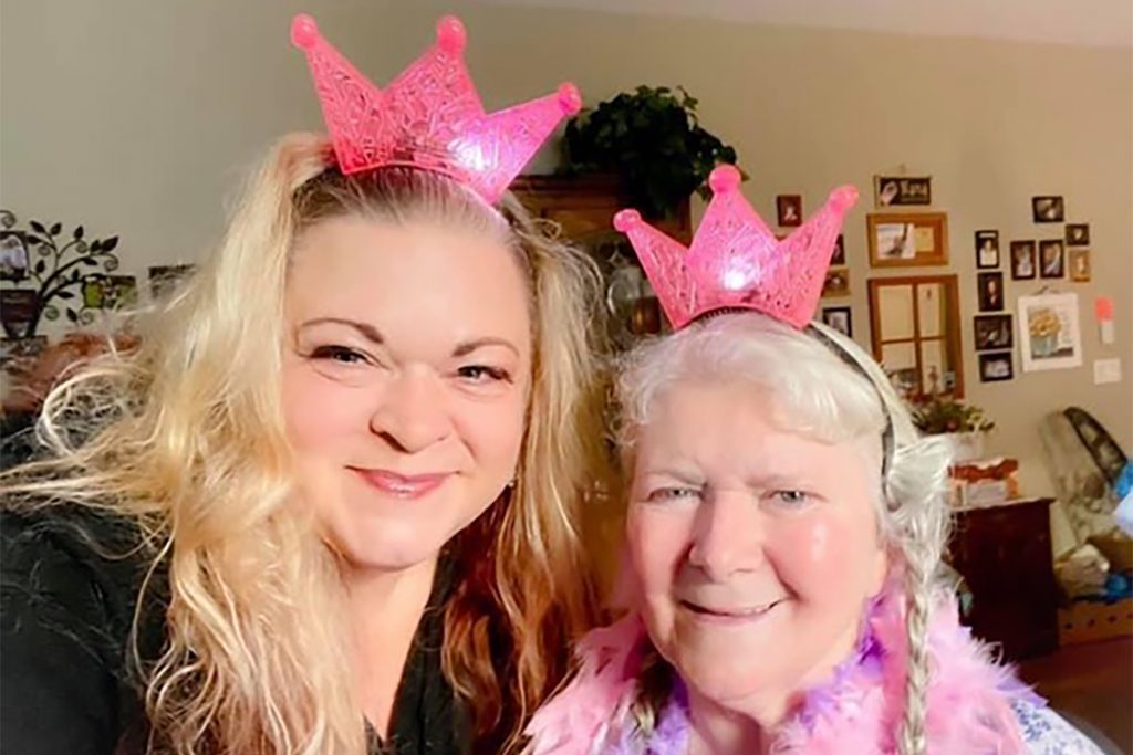 Christina Keys poses for a selfie with her mother, Patricia. The two are wearing matching pink tiaras.