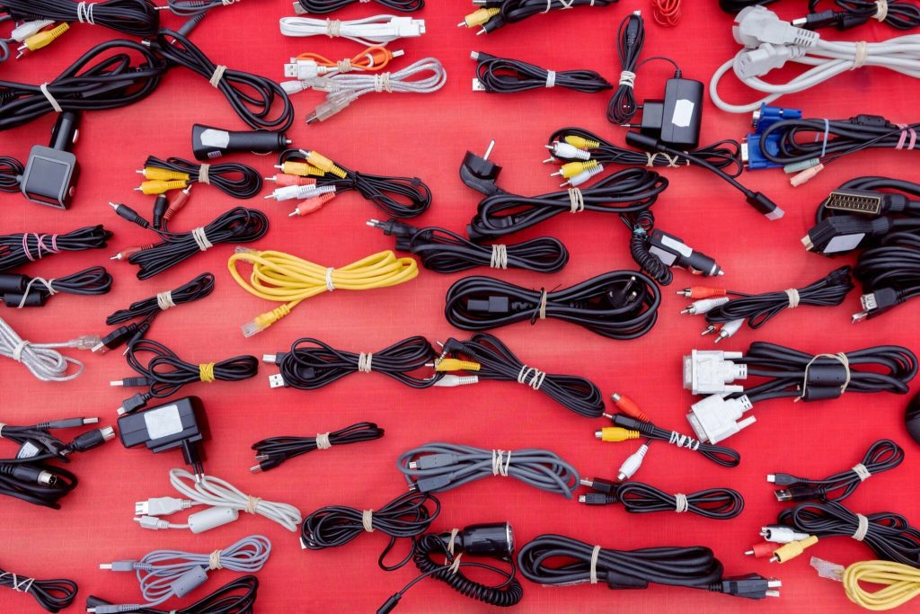 Assortment of Used Cables in Different Types and purposes on second hand market, peripheral equipment"nVideo Audio Cable USB and Bundled Top view From Above. Tech