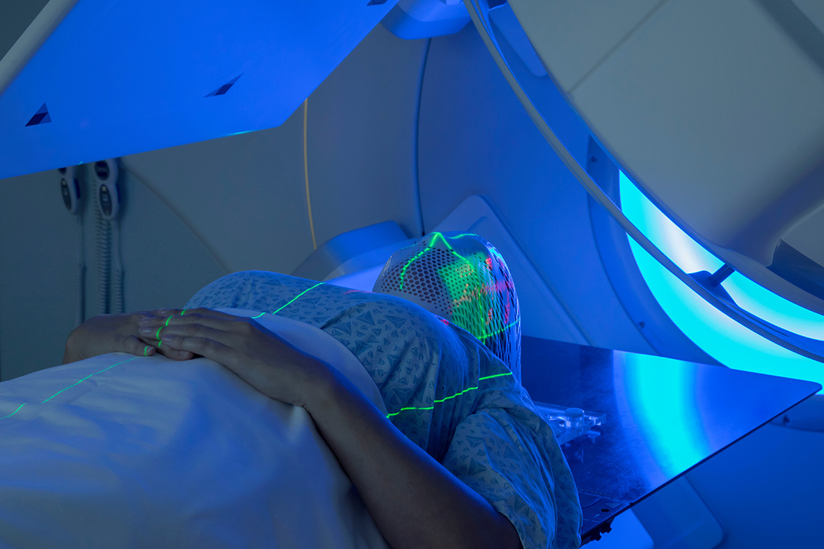 Woman receiving radiotherapy for cancer in a private hospital using health insurance