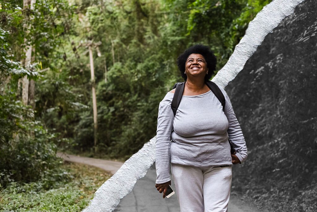 A woman relaxes by taking a hike on a park path