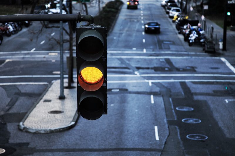 Close up of a traffic light on yellow