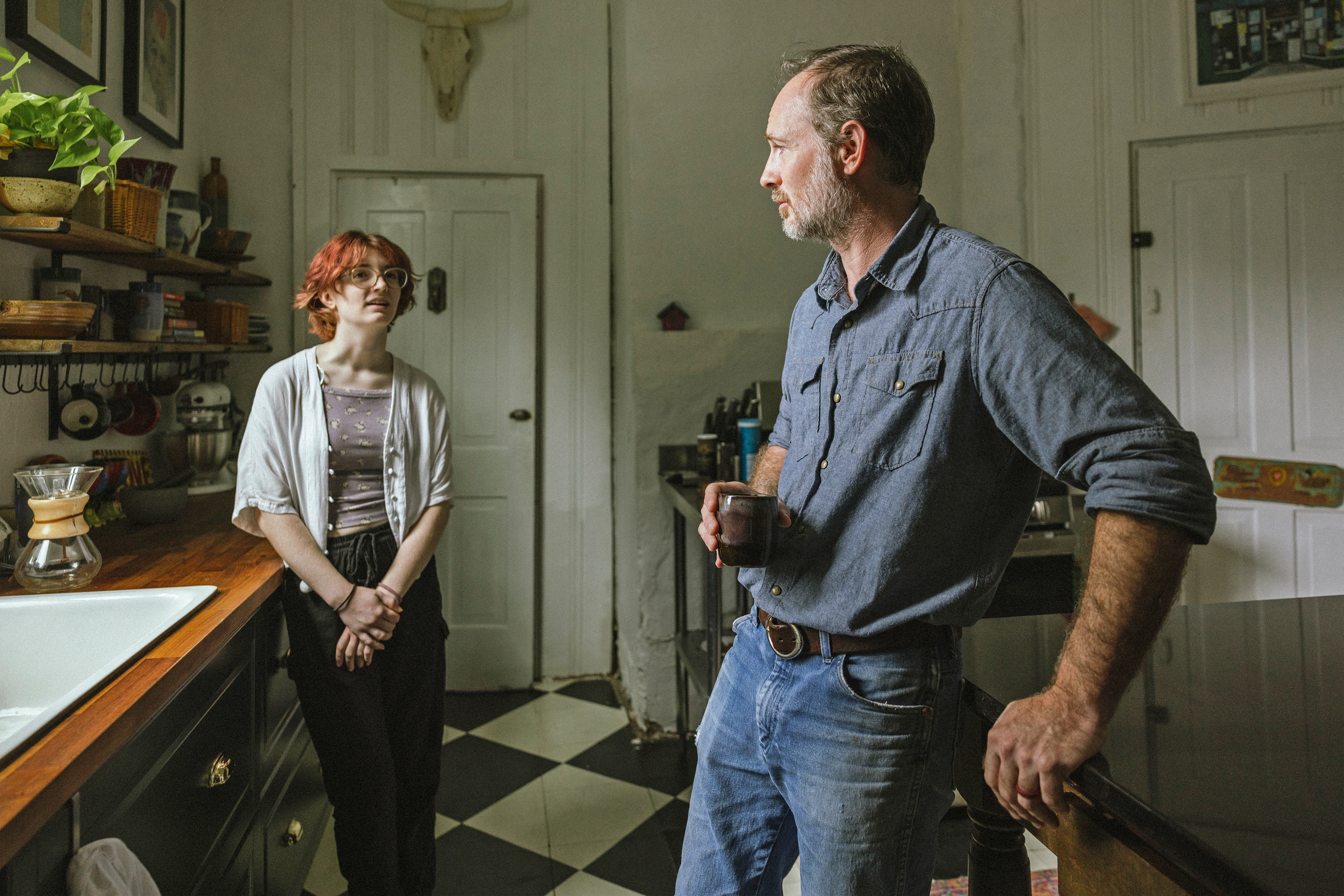 A photo shows Frankie Cook conversing with her dad in the kitchen.