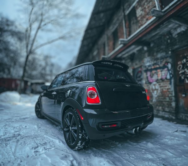 Black Mini Cooper out in the snow