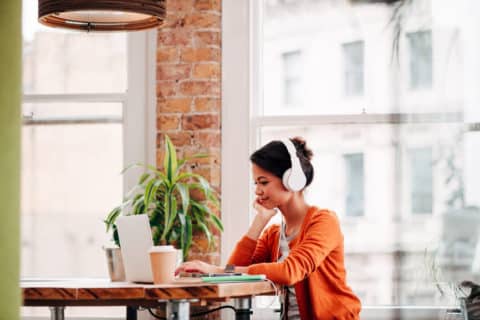 Ambitious Businesswoman working on technology device laptop at work startup planning the next move