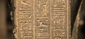 Image of Egyptian hieroglyphics stone tablet for Quotacy blog Clauses and Exclusions: Things to Know About Your Policy.