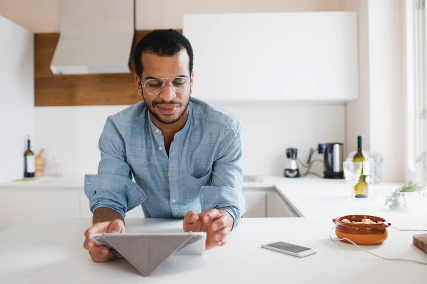 Handsome Young Man Using Tablet At Home