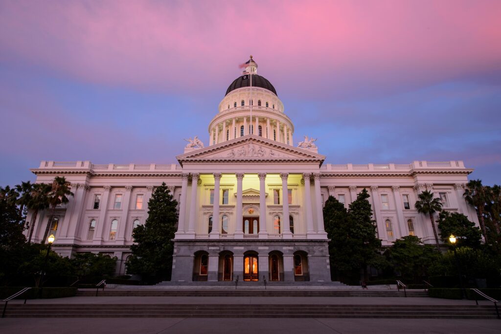 California's capitol building is seen at sunset.