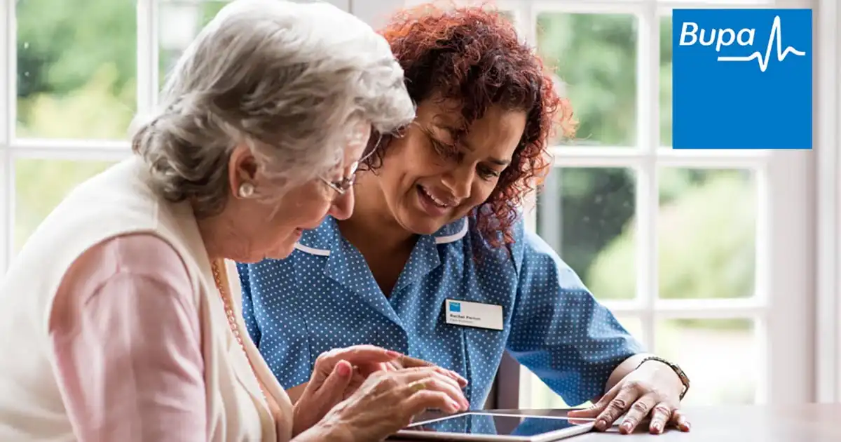 Nurse looking at Bupa costs with patient