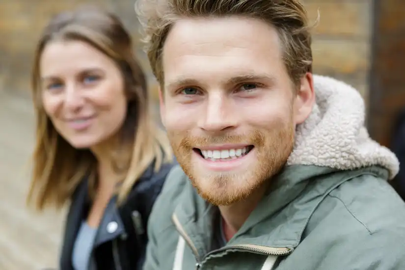 Young couple smiling at the camera