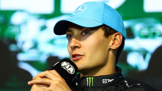 A photo of George Russell in an F1 press conference. 