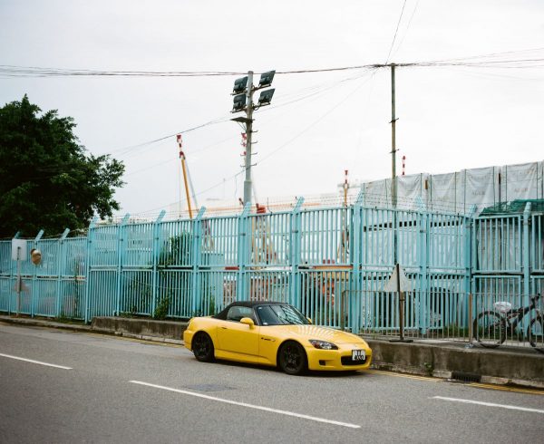 Yellow Honda S2000 parked