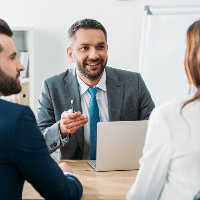 Advisor talking to client couple