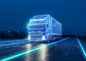 Futuristic Technology Concept: Autonomous Semi Truck with Cargo Trailer Drives at Night on the Road with Sensors Scanning Surrounding. Special Effects of Self Driving Truck Digitalizing Freeway