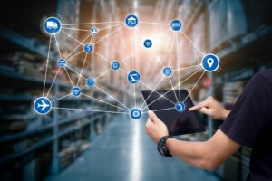 Man hands using tablet in a supply chain warehouse