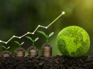 Plants grow on top of a stack of coins, increasing in size. To the right sits a grassy globe.