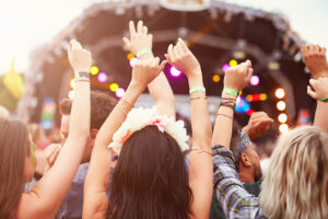 audience with hands in the air at a music festival