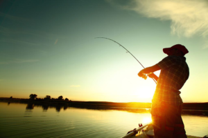 man fishing at sunset