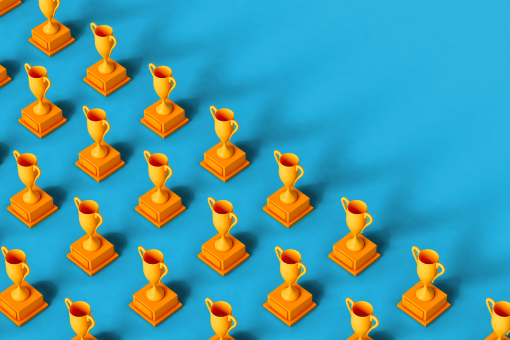 3D render of a yellow trophy on a green background. copy space on the right part of the image