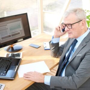 A senior man talking on the phone