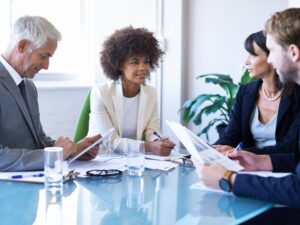 Diverse group at a conference table.