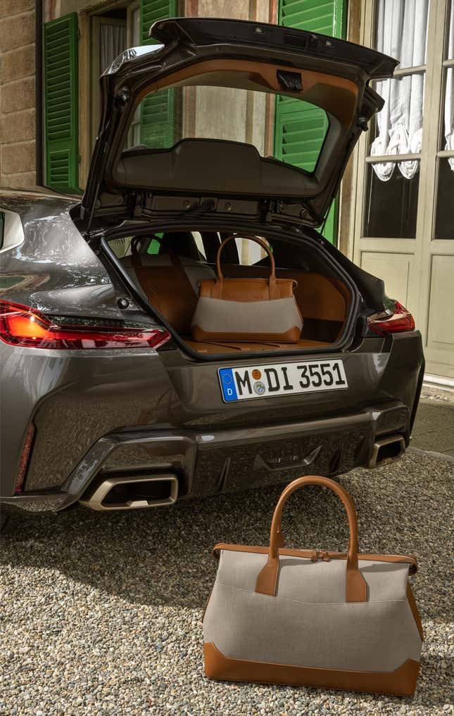 The rear hatch is open on the BMW shooting brake concept car. There is fitted luggage inside.
