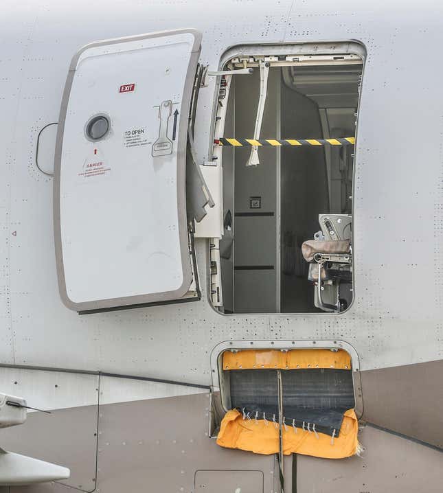 An emergency exit door of an Asiana Airlines plane is seen at Daegu International Airport in Daegu, South Korea, Friday, May 26, 2023, after a passenger opened it during a flight. A