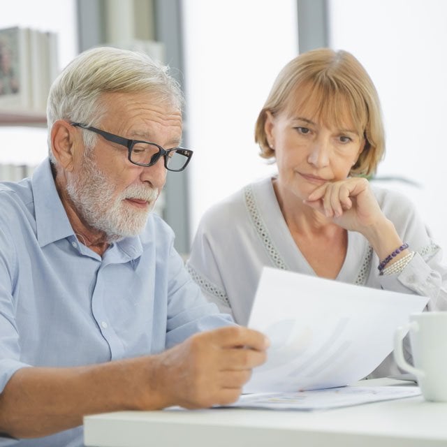 Senior couple looking at documents