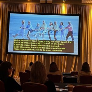 FPA Retreat attendees watch a presentation about marketing to the baby boomers. (Photo: Margie Barrie)