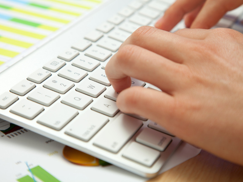 Hands typing on a keyboard