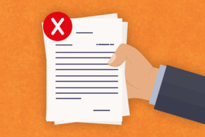 A vector illustration of a hand holding papers marked with a white X in a red circle.