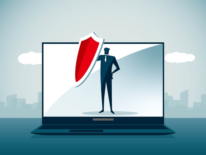 Illustration of a businessman standing on a laptop and holding a red shield