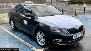 newcastle taxi black car with white bonnet